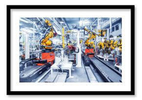 robotic arms in a car plant