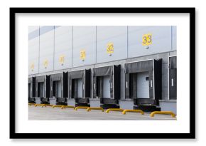 Entrance ramps of a large distribution warehouse with gates for loading goods