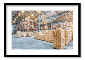 Large industrial warehouse with high racks. In the foreground are a lot of cardboard boxes.