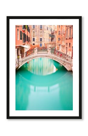 Venice, Bridge on water canall. Long exposure photography.