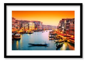 Venice, Italy. Gondola floats on Grand Canal at sunset