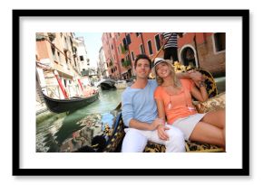Couple in Venice having a Gondola ride on the canal