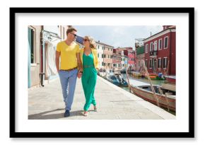 Tourist couple visiting Burano island