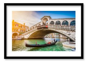 Gondola with Rialto Bridge at sunset, Venice, Italy