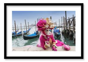 Carnival mask and gondolas in Venice