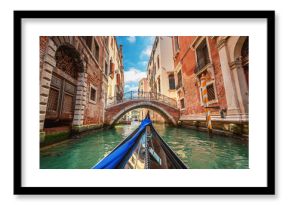 View from gondola during the ride through the canals of Venice i