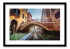 View from gondola during the ride through the canals of Venice i