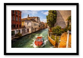 VENICE, ITALY - AUGUST 17, 2016: Retro brown taxi boat on water in Venice on August 17, 2016 in Venice, Italy.