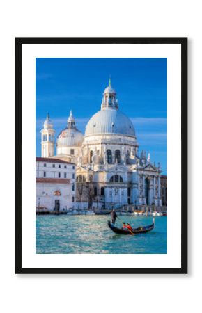 Grand Canal with gondola against Basilica Santa Maria della Salute in Venice, Italy