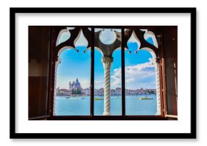 Spectacular view of Venice from a typical Venetian window. The city is preparing for Redentore. Bell tower of Saint Mark, basilica and Giudecca canal are the main subjects