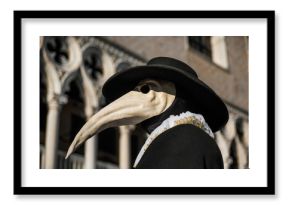 Plague Doctor Mask, traditional venetian costume of Venice Carnival, with Doge Palace gothic decoration in the background