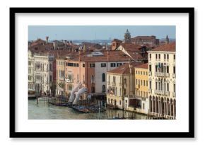 Giant hands rise from the water of Grand Canal to support the building in Venice. This powerful report on climate change from the artist Lorenzo Quinn. Venice landmarks.