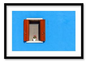 Window on blue wall in Burano, Italy.