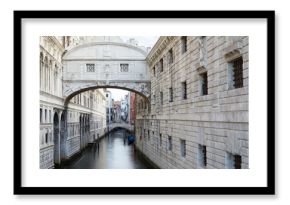 Bridge of Sighs in the early morning, calm water in Venice, Italy