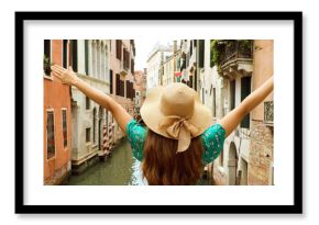 Europe travel vacation fun summer woman with arms up and hat happy in Venice, Italy. Panoramic banner view of carefree girl tourist in European destination wearing green fashion dress.