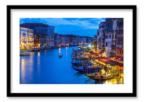 Night view of Grand Canal with gondolas in Venice. Italy