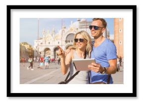 Tourists using tablet computer while traveling