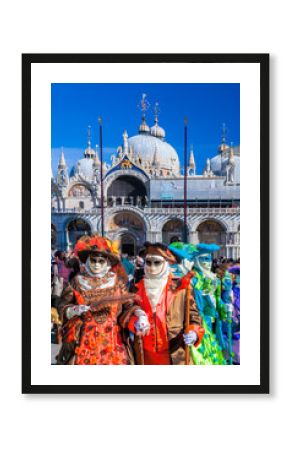 Venice with carnival masks against Mark's Square in Italy