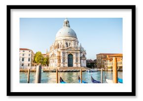 Venice cityscape view on Santa Maria della Salute basilica with gondolas on the Grand canal in Venice
