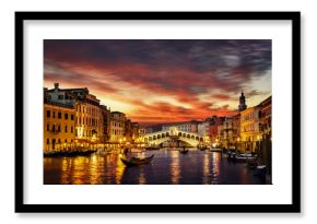 Ponte Rialto and gondola at sunset in Venice, Italy