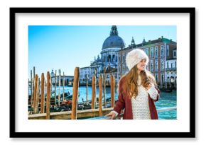 traveller woman on embankment in Venice having walking tour