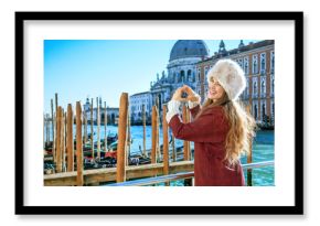 traveller woman in Venice, Italy showing heart shaped hands