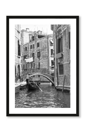 Venetian view with small canal with gondola