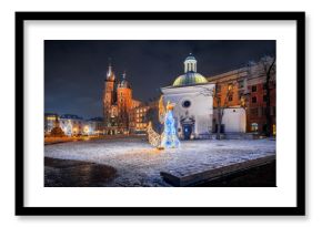 The main square in Krakow with a view of the cloth hall and St. Mary's Basilica in winter. Rynek główny w krakowie z widokiem na sukiennice, bazylikę mariacką w zimie. 