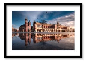 The main square in Krakow with a view of the cloth hall, St. Mary's Basilica in a natural mirror. Rynek główny w krakowie z widokiem na sukiennice, bazylikę mariacką w naturalnym lustrze.