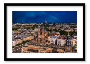 The old town of Krakow in Poland, with a storm and a rainbow in the background.