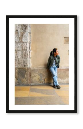 woman exploring Rynek Glowny Square in Krakow