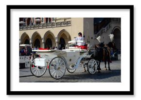 Cab on the main square - old town in Krakow, Poland