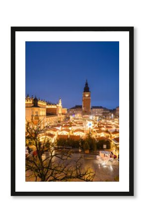View of the Krakow Christmas Market 2024 and the historic Old Town Square, beautifully illuminated with festive lights and vibrant holiday atmosphere.