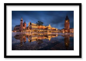 The main square in Krakow with a view of the cloth hall, St. Mary's Basilica in a natural mirror. Rynek główny w krakowie z widokiem na sukiennice, bazylikę mariacką w naturalnym lustrze.