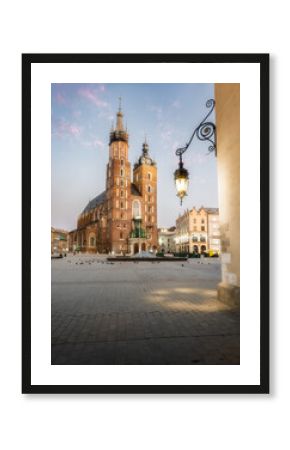 Asymmetrical Towers of St. Mary's Basilica at Sunset in Krakow's Rynek