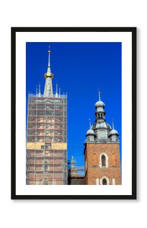 Towers of St. Mary's Basilica at the Main Market Square in the Old Town of Krakow, Poland. Bazylika Mariacka under reconstruction