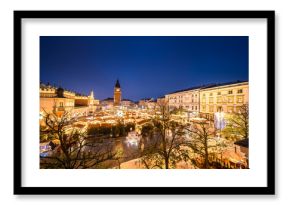 View of the Krakow Christmas Market 2024 and the historic Old Town Square, beautifully illuminated with festive lights and vibrant holiday atmosphere.
