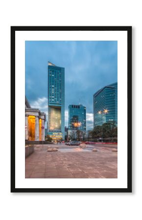 Warsaw, capital of Poland, modern skyscrapers on Emilii Plater street in the evening