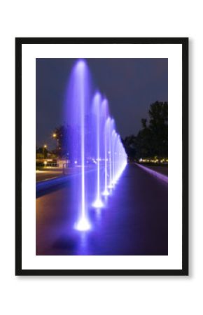 The illuminated fountain at night
