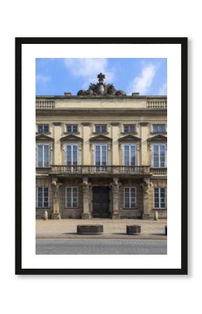 Facade of a beautiful old building and a balcony with the Atlant