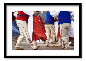 Horizontal colour image of female polish dancers in traditional