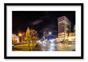 Night skyline of Warsaw with soviet era Palace of Culture and science and modern skyscrapers. 360 degree panoramic montage from 20 images