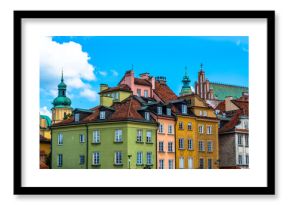 Colorful houses in the old town in Warsaw at the castle square. Sunny summer day with a blue sky. Horizontal photo.