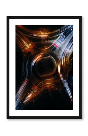 roundabout from above with car light streaks