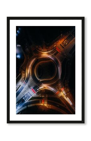 roundabout from above with car light streaks