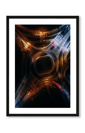 roundabout from above with car light streaks