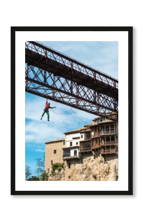Fearless climber climbing metal construction 