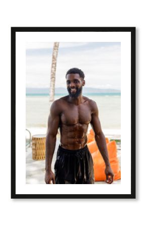 Portrait of smiling man during workout in the gym