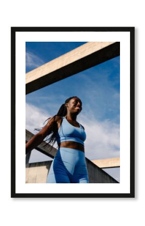 Empowered woman dressed in sportswear enjoys a morning of exercise