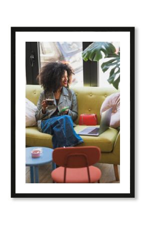 Modern Woman Enjoying Coffee While Relaxing at Comfortable Cafe